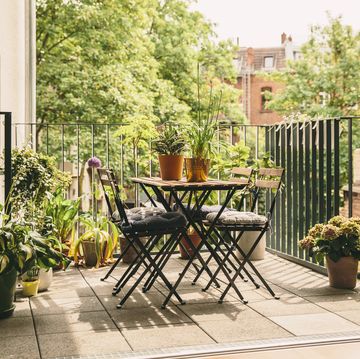 small garden ideas, bistro chairs and table on balcony with view in the yard