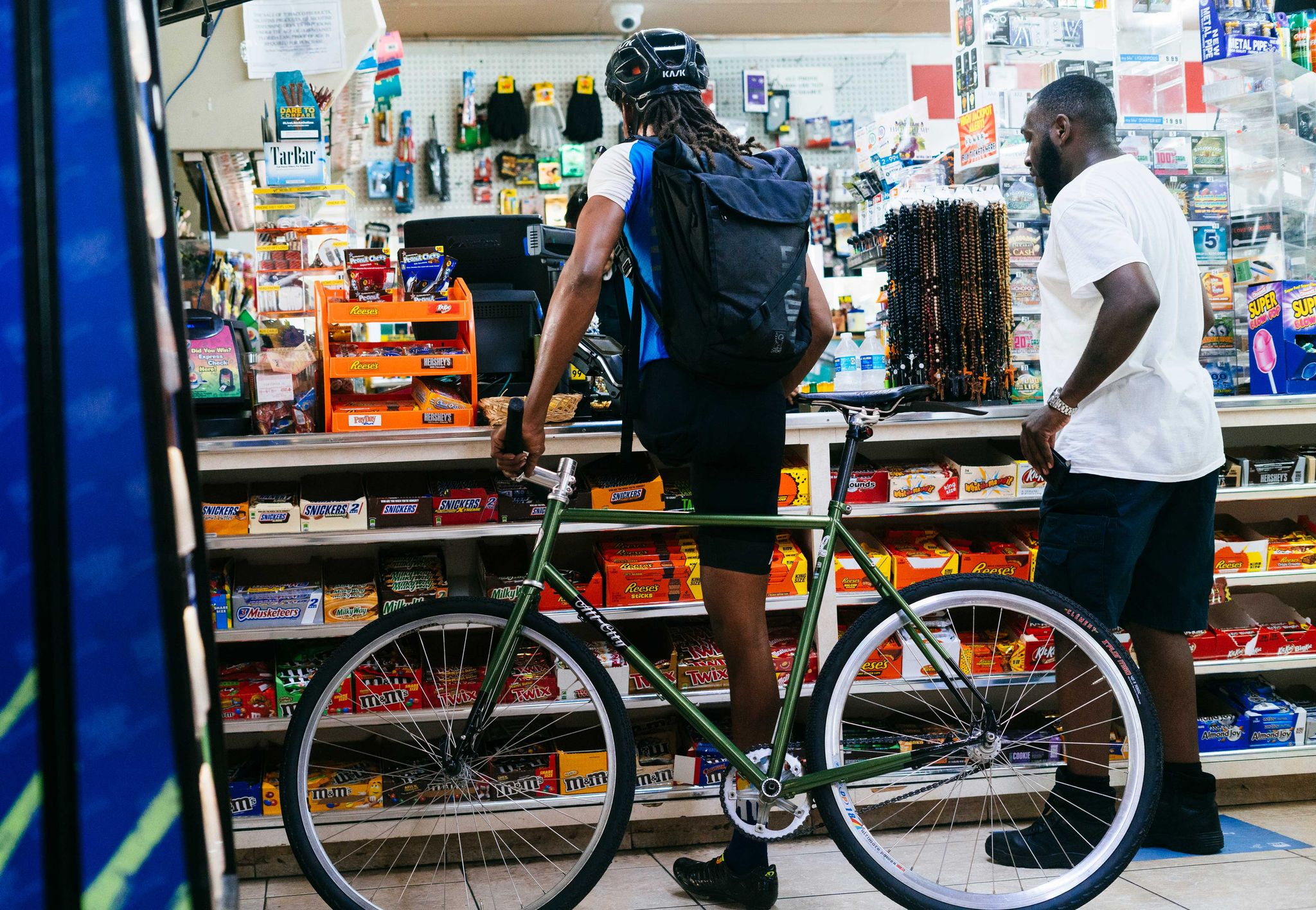 leo rodgers stops to buy water and sports drinks during a group ride in downtown tampa in july 2018