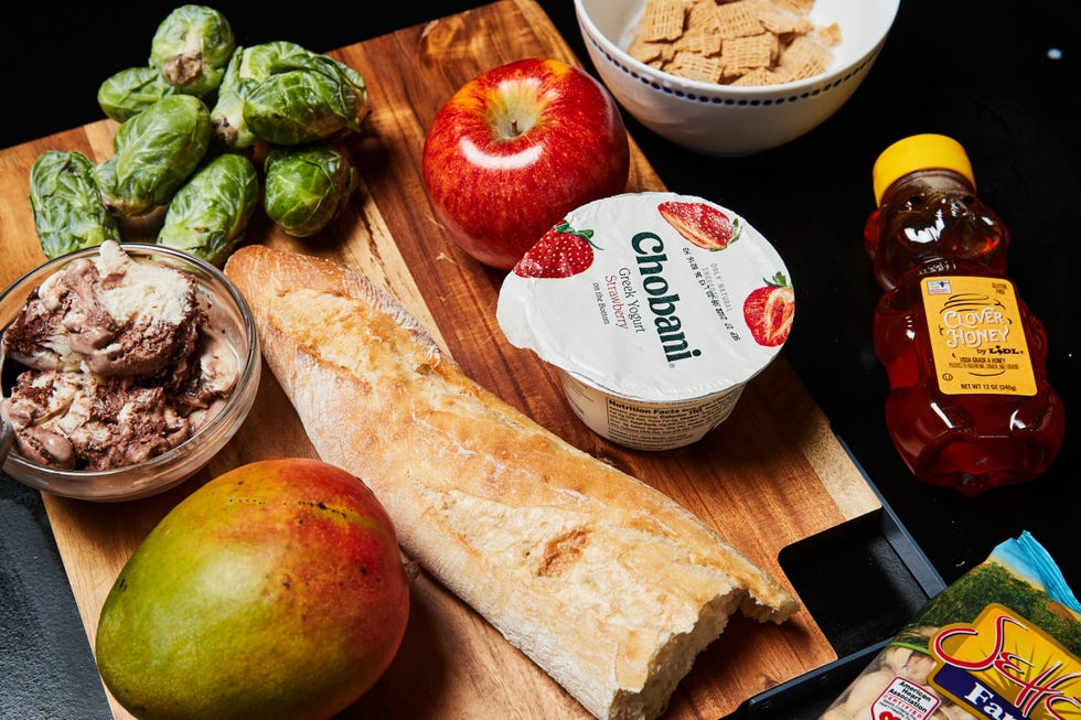 Arrangement of various food items on a wooden cutting board