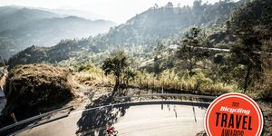 two riders prepare for a descent in the eastern range of the colombian andes mountains