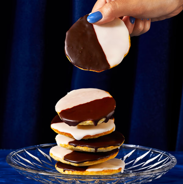 stack of black and white cookies on clear plate