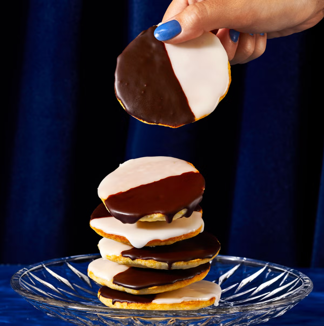 stack of black and white cookies on clear plate