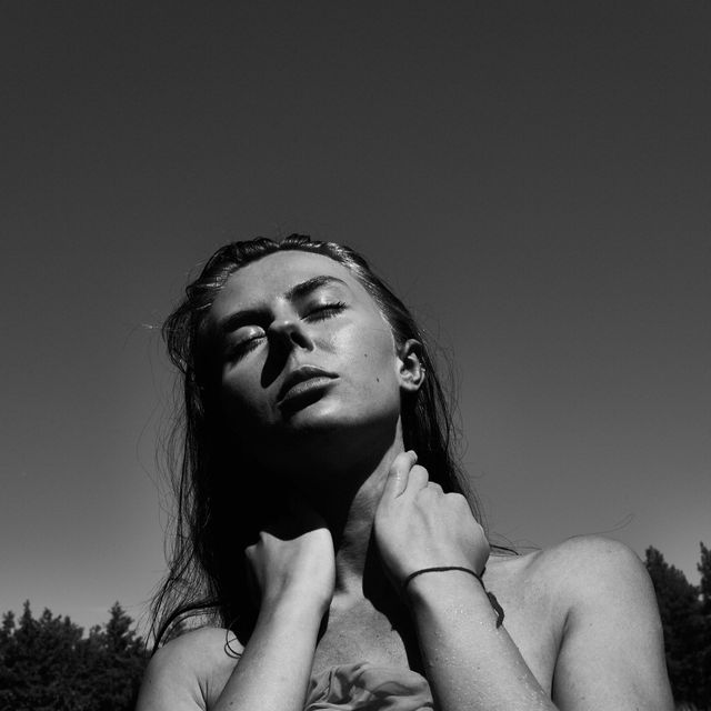 black and white portrait of young woman in hot summer day at lake person