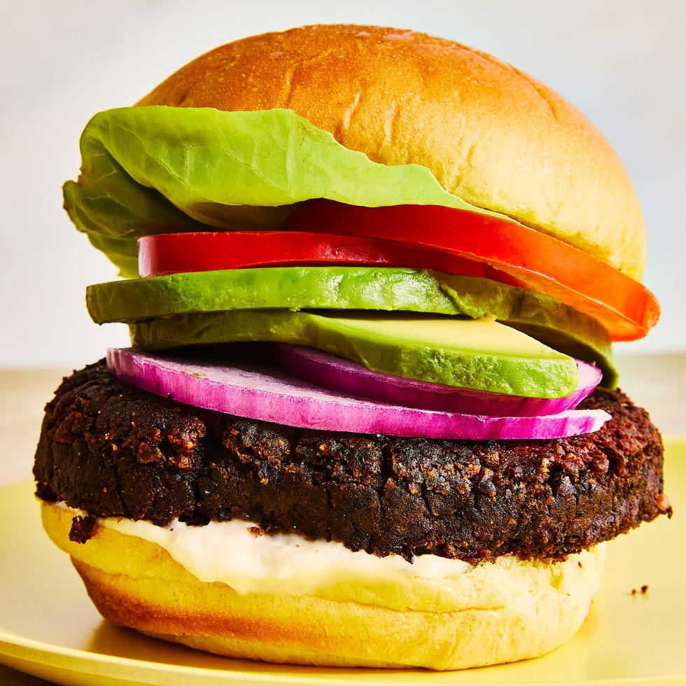 black bean burgers with tomato, lettuce, red onion, and avocado