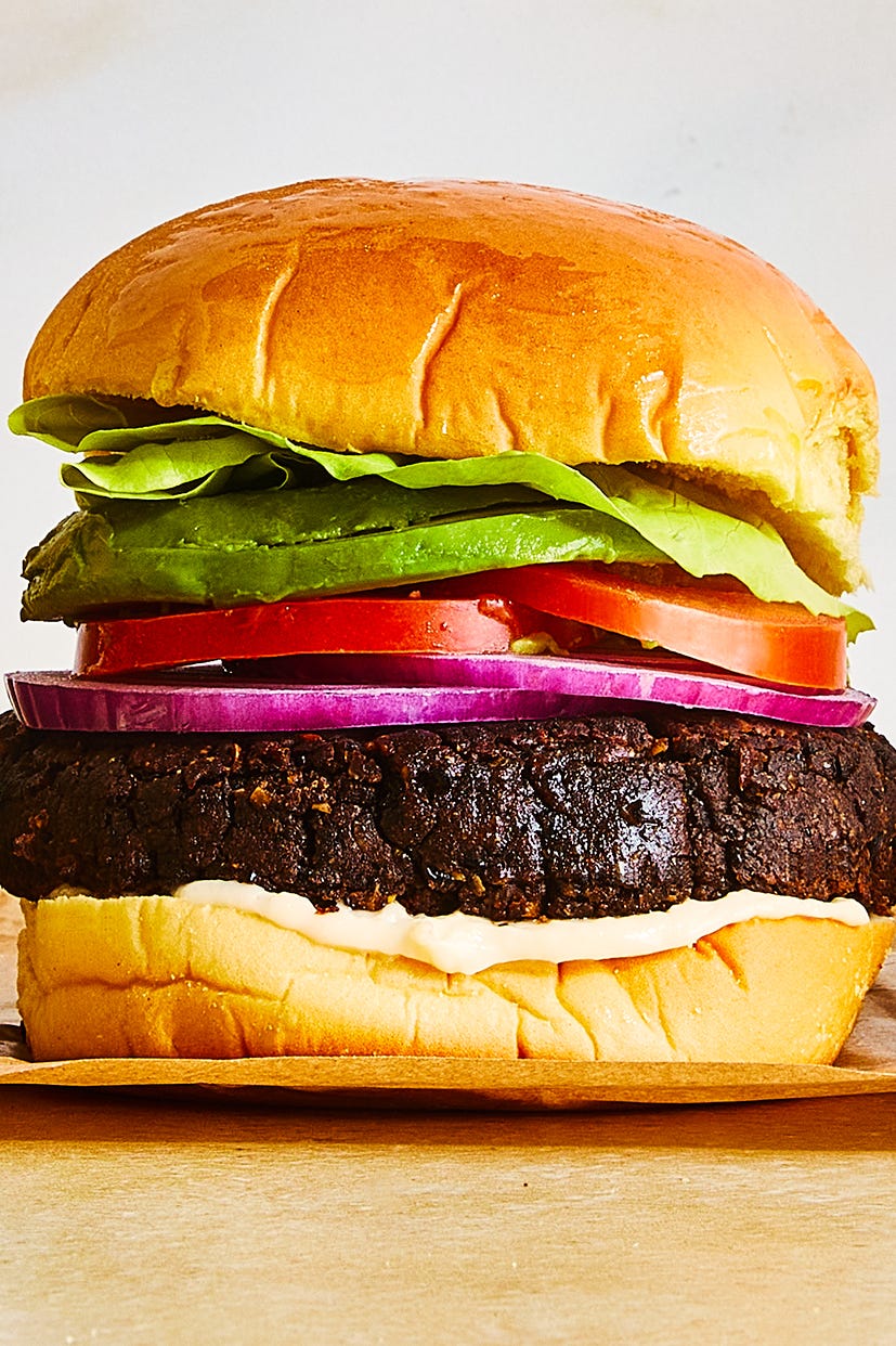 Black Bean Burgers black bean burgers with tomato, lettuce, red onion, and avocado