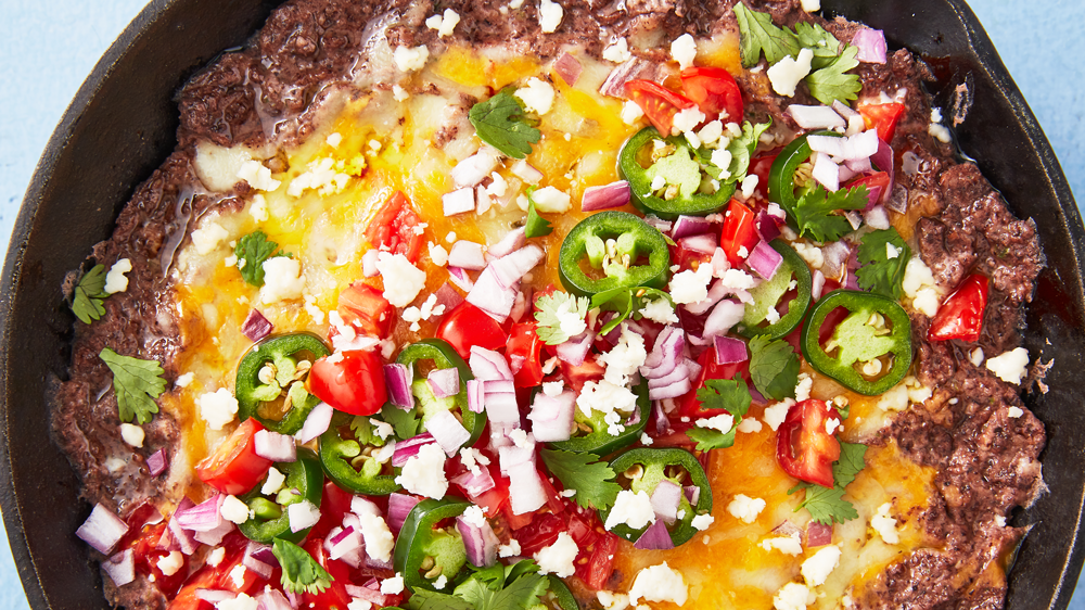 preview for This Black Bean Dip Is Filled With Cheese And Has The Best Toppings