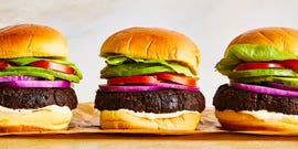 black bean burgers with tomato, lettuce, red onion, and avocado