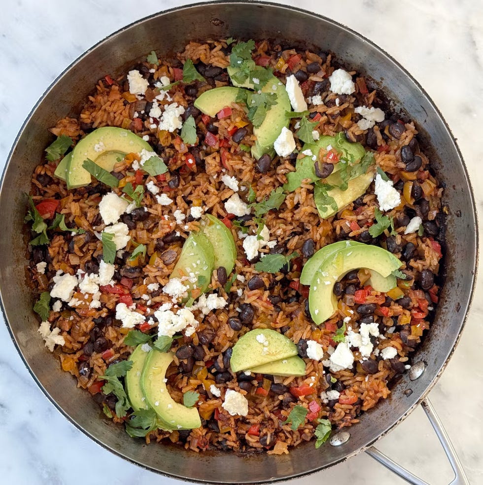 black bean rice skillet with slice of avocado on top