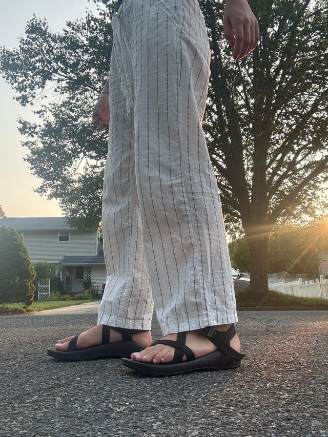 cavallo on a long walk wearing the ﻿z 1 adjustable strap classic sandal in black