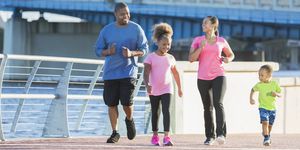 black family staying fit, power walking on waterfront