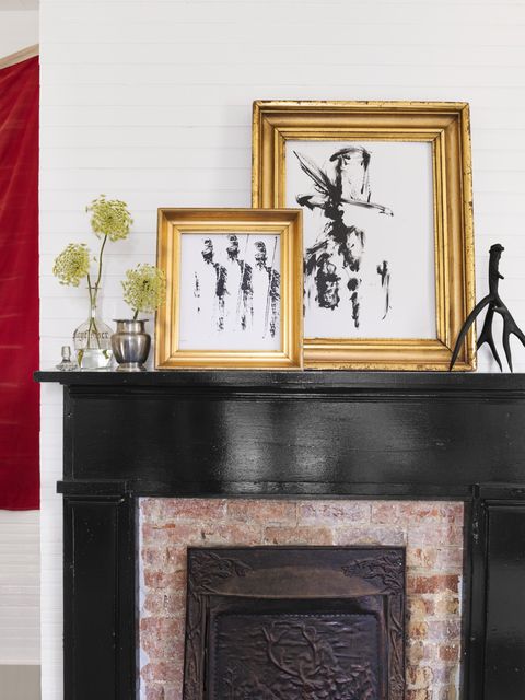 black fireplace and art