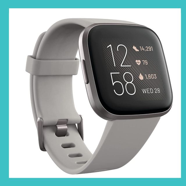 fitbit versa and revlon one step volumizer on white background with blue border