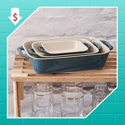 blue staub casserole dishes stacked on top of glasses and silver kitchenaid stand mixer