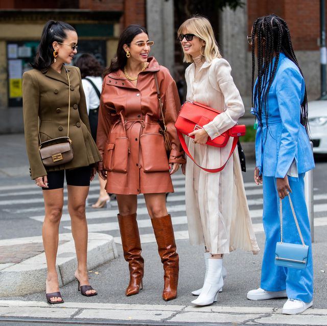 milan, italy   september 19 anna rosa vitiello wearing cycle pants, olive double breasted jacket, fendi bag, bettina looney wearing rusty brown coat, boots, xenia adonts wearing red fendi bag, creme white dress, chrissy rutherford wearing blue jacket and pants seen outside the fendi show during milan fashion week springsummer 2020 on september 19, 2019 in milan, italy photo by christian vieriggetty images
