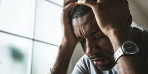 Black guy stressing and headache