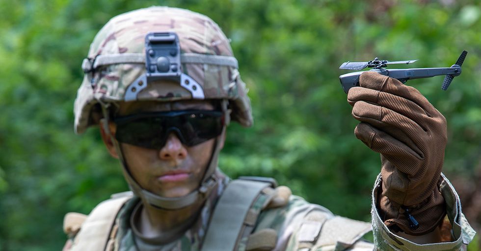 cadet mckensey cope, a fourth year usma cadet selected to pilot the soldier borne sensor sbs, demonstrates the sbs to fellow cadets during the united states military academy usma at west point cadet leader development training cldt in july