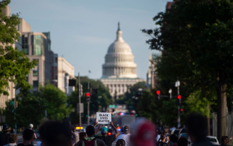black lives matter protesters march through the streets near the us capitol in washington, dc on june 24, 2020