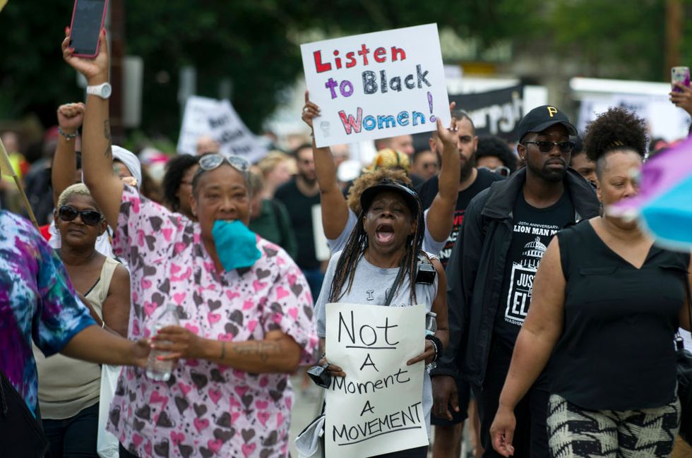 pittsburgh, pa   august 19 marchers walk through the homewood neighborhood during their black brilliance collective march and gathering august 19, 2017 in pittsburgh, pennsylvania just one week after the violent unite the right rally in virginia that left one woman dead and dozens more injured people have come out in solidarity with charlottesville and to protect their neighborhoods photo by jeff swensengetty images