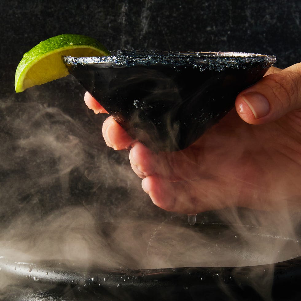 black magic margaritas in a cup of ice