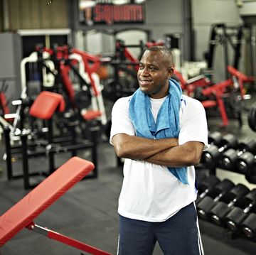black male standing in local gym after workout