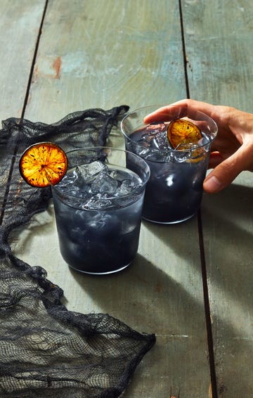 black margaritas with torched limes