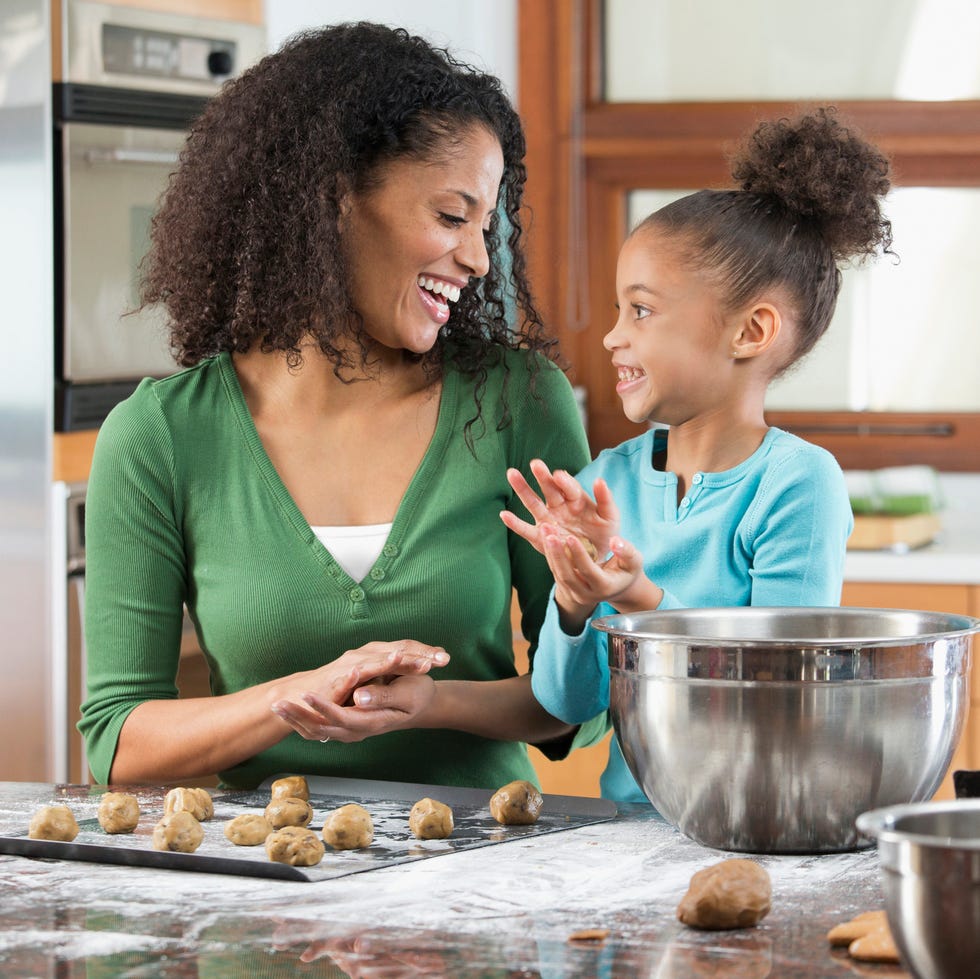 jobs for stay at home moms - Black mother and daughter baking in kitchen