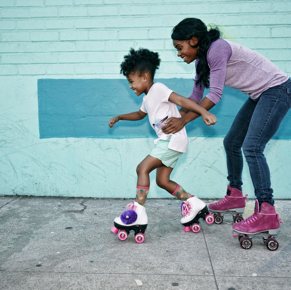 how to forgive yourself black mother holding waist of daughter wearing roller skates
