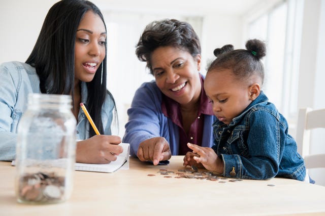 black multigeneration family counting coins
