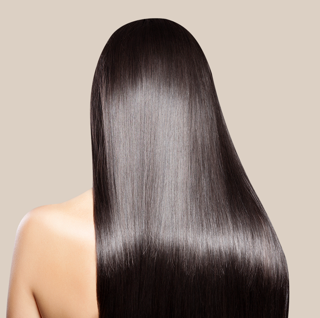 black seed oil for hair   image of a woman with long shiny black hair