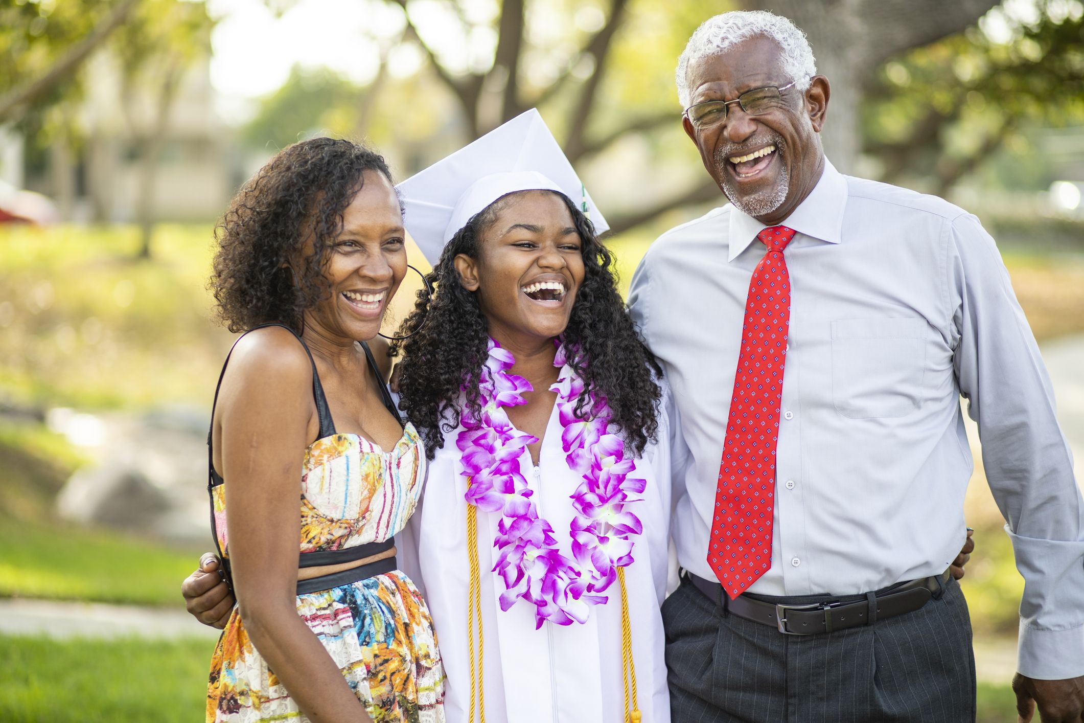 A young male happy graduate poses for his graduation photo Stock Photo -  Alamy