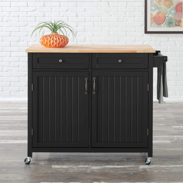 a black desk with a plant on top a black desk with a plant on top