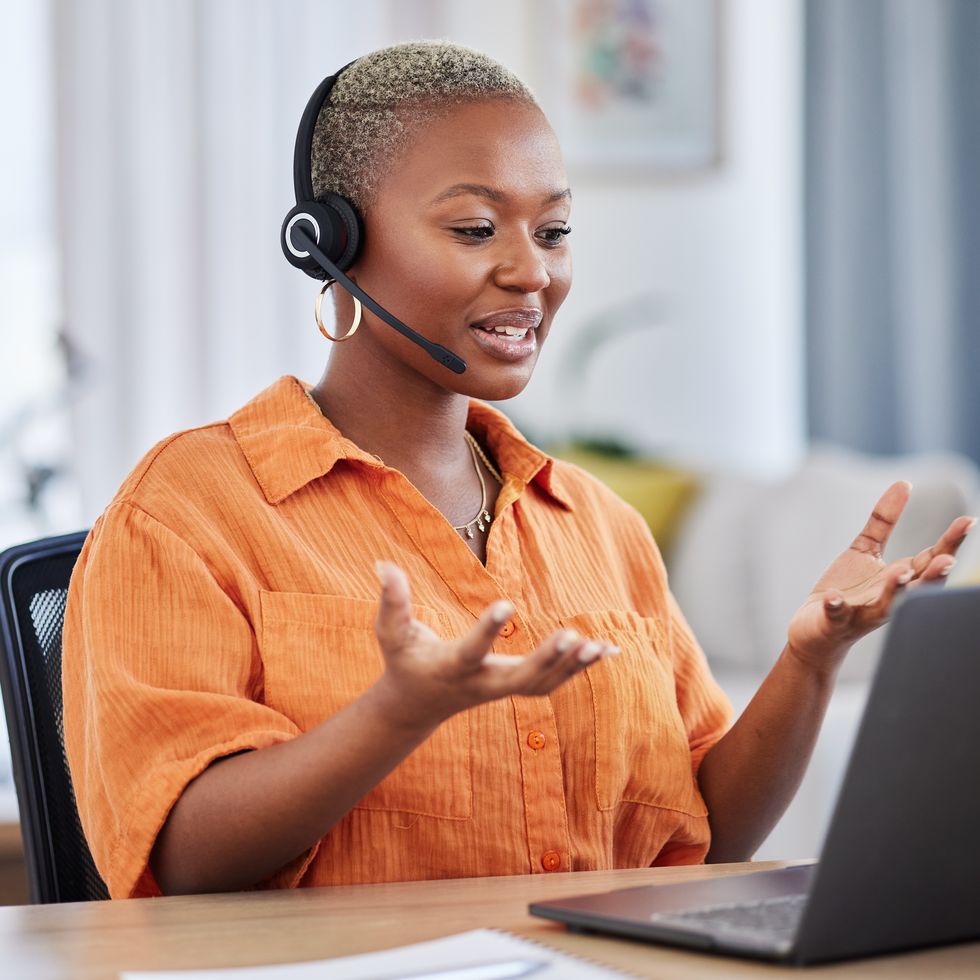 black woman, call center and consulting on laptop in customer service, support or telemarketing at home. african freelance person or consultant agent talking on computer with headset in online advice
