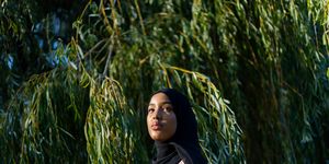 black woman in hijab in nature