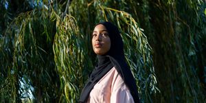 black woman in hijab in nature