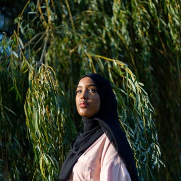 black woman in hijab in nature