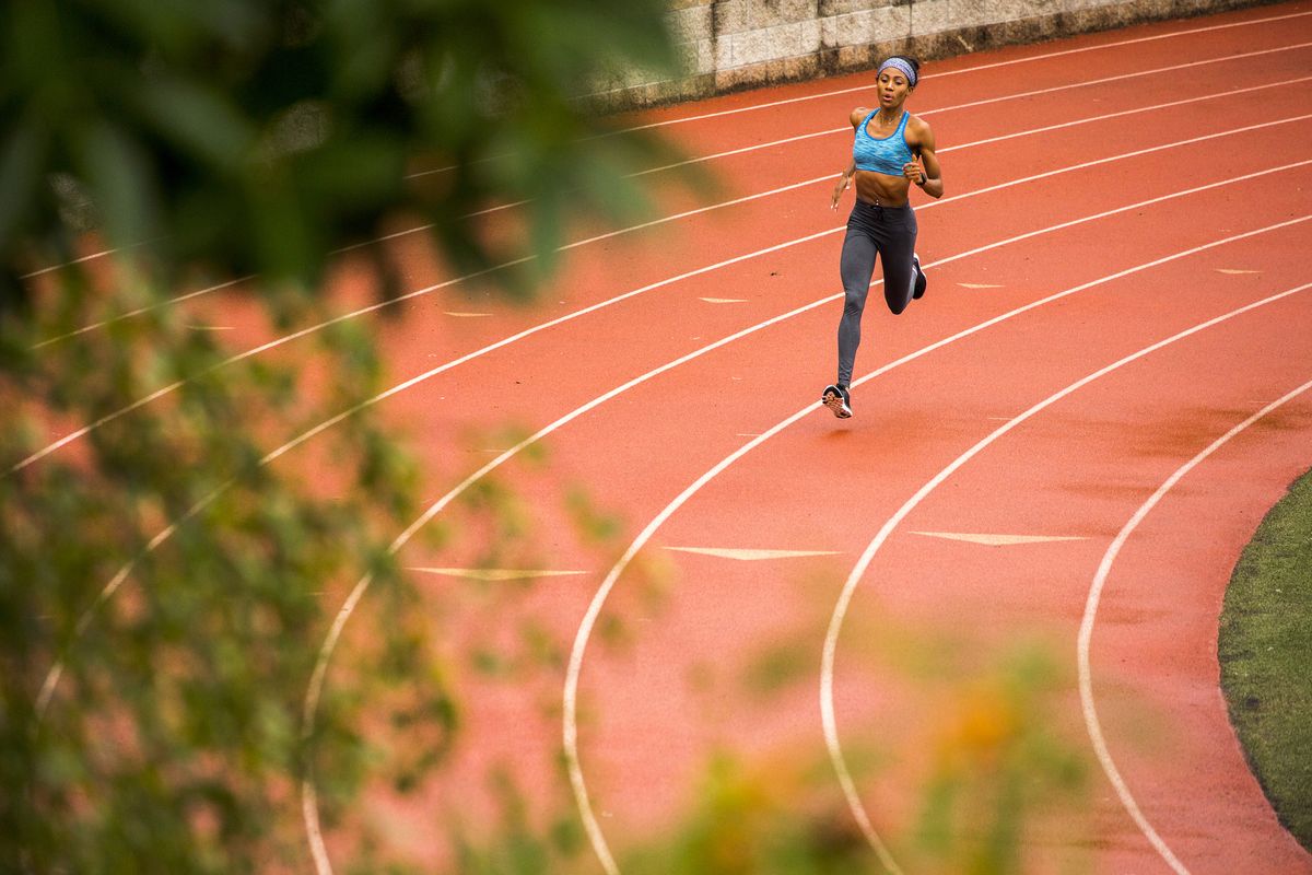 black woman running on track