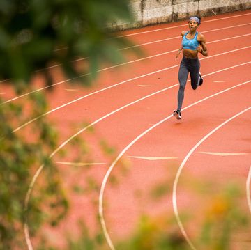 black woman running on track
