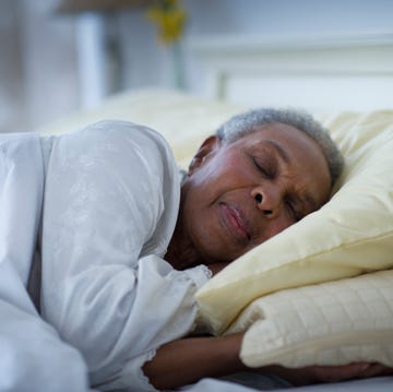 black woman sleeping in bed