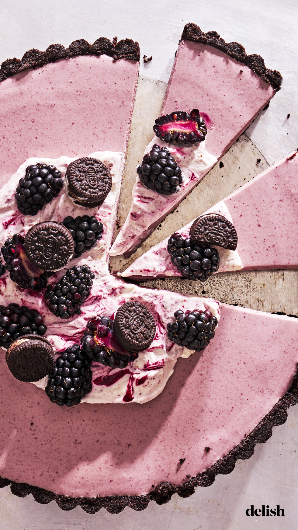 no baked blackberry oreo tart with mascrapone whipped cream and blackberry filling and an oreo crust