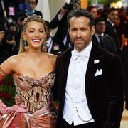 blake lively and ryan reynolds posing with smiles at the 2022 costume institute benefit in america an anthology of fashion