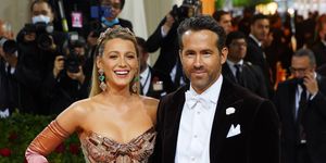 blake lively and ryan reynolds posing with smiles at the 2022 costume institute benefit in america an anthology of fashion