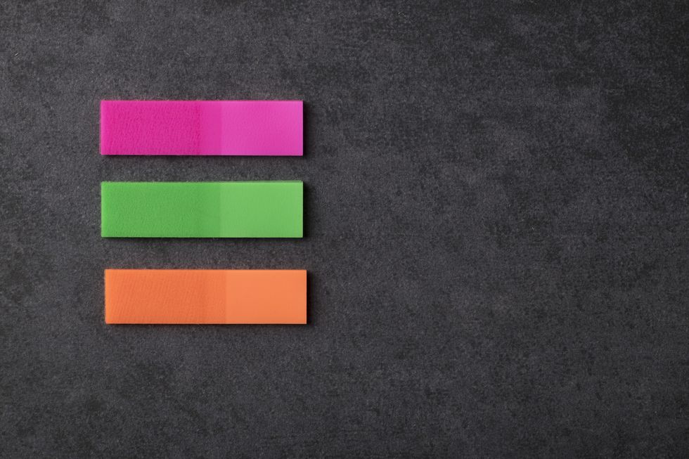 blank colorfull sticky notes on black background