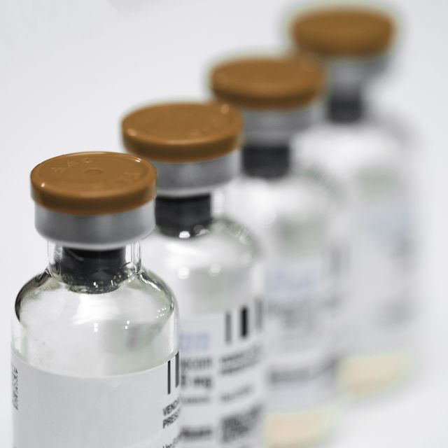 blank label vaccine bottle in row