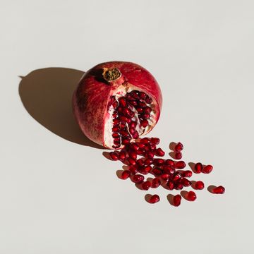 a cut pomegranate to with seeds spilling out to symbolise bleeding after sex
