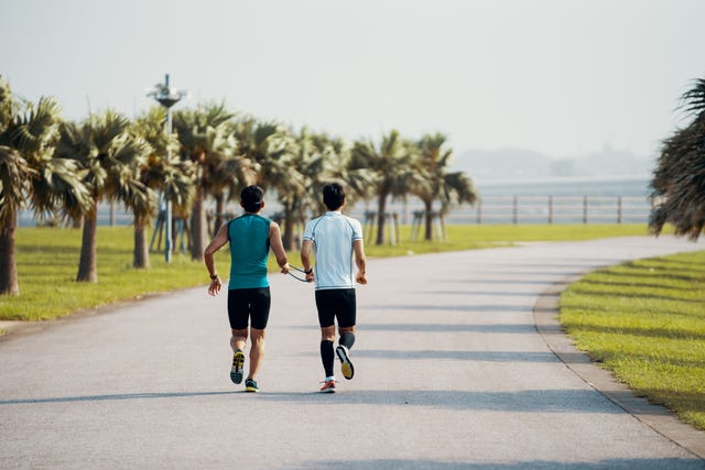 Blind triathlete running and training with his guide