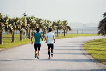 Blind triathlete running and training with his guide
