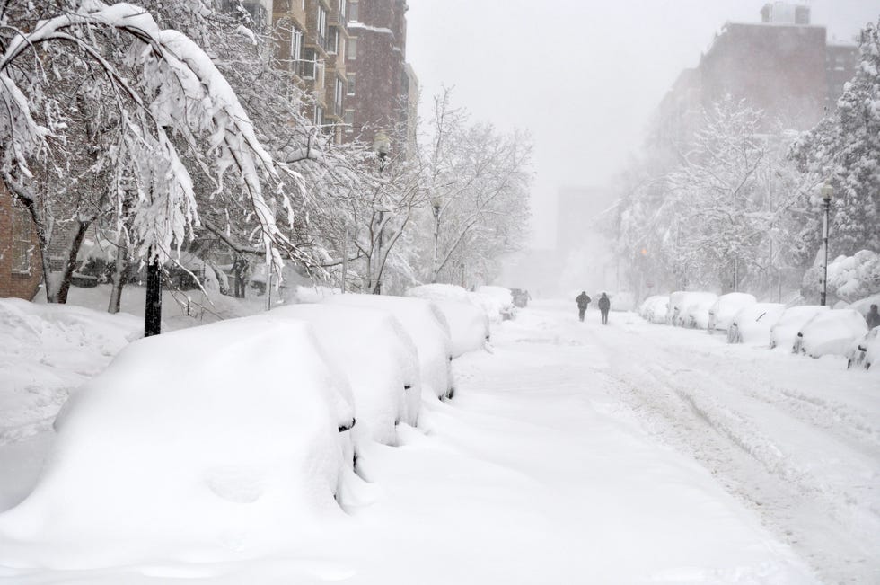 block of snow covered cars