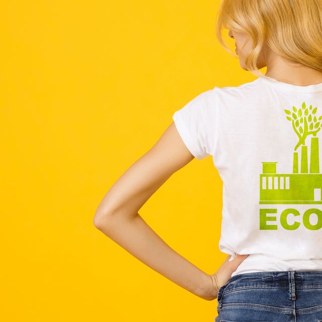 blond girl wearing white t shirt with green eco print, rear view