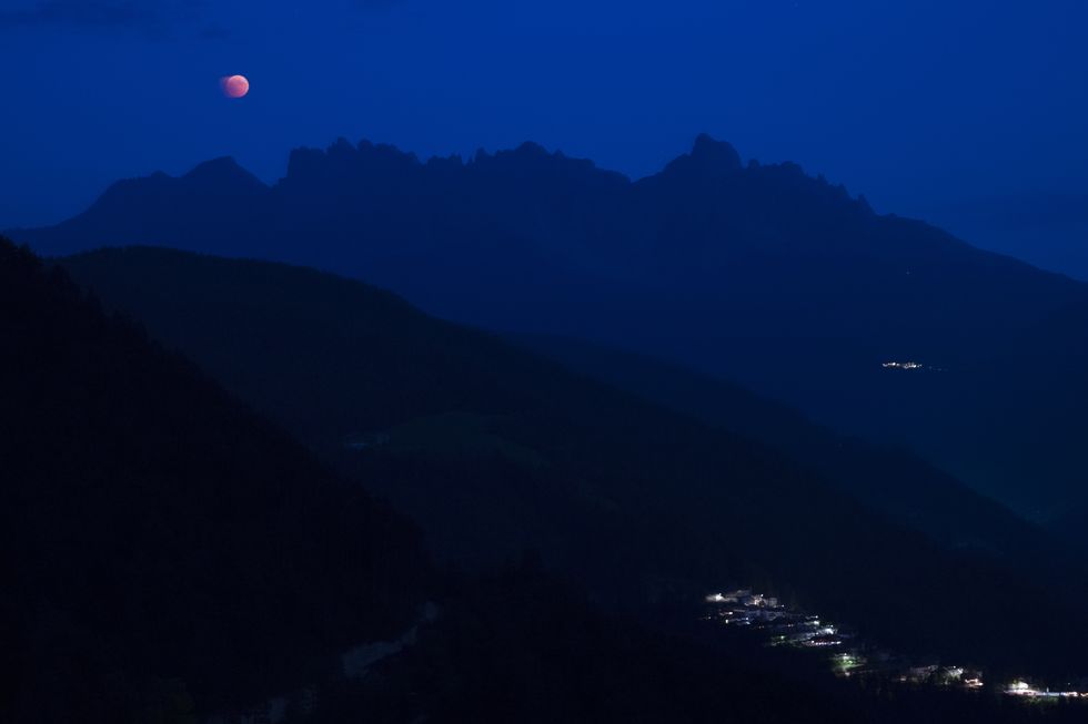 Blood moon lunar eclipse seen from the observatory of San Valentino, BZ, South Tyrol, Italy