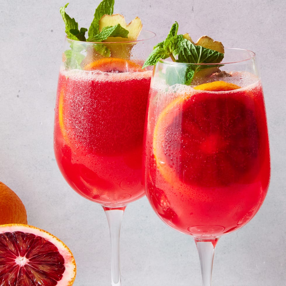 blood orange mocktail with a blood orange slice, mint, and ginger